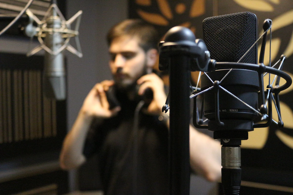Home recording studio with audio interface, microphone, and monitors on desk