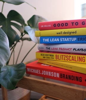 books on brown wooden shelf