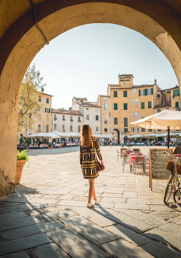 Woman in summer dress walking on sidewalk in warm weather