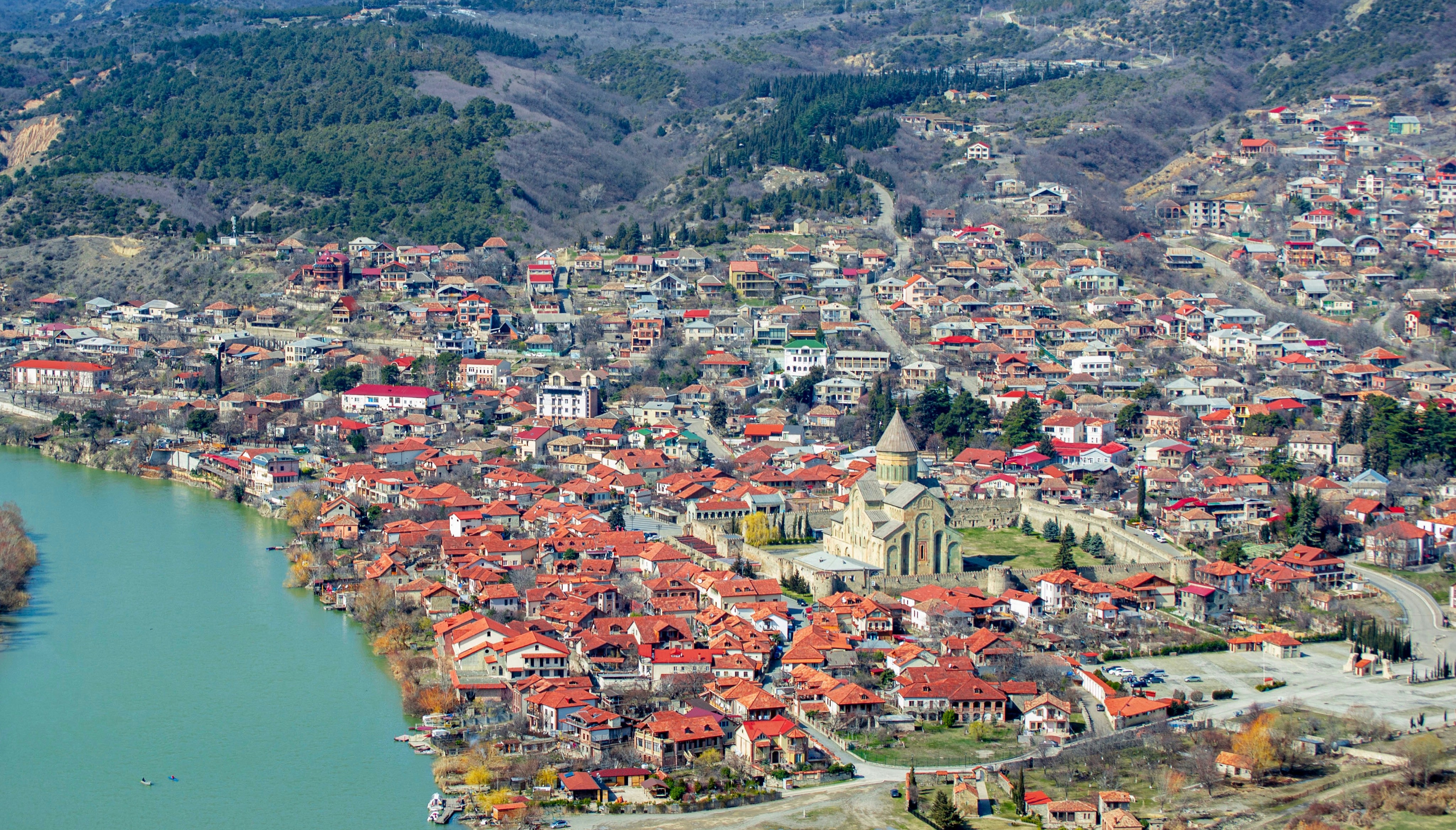 aerial view of city near lake during daytime