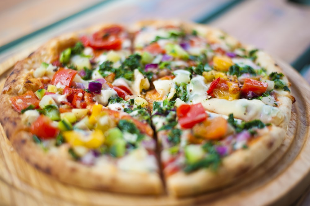 pizza with cheese and green leaves