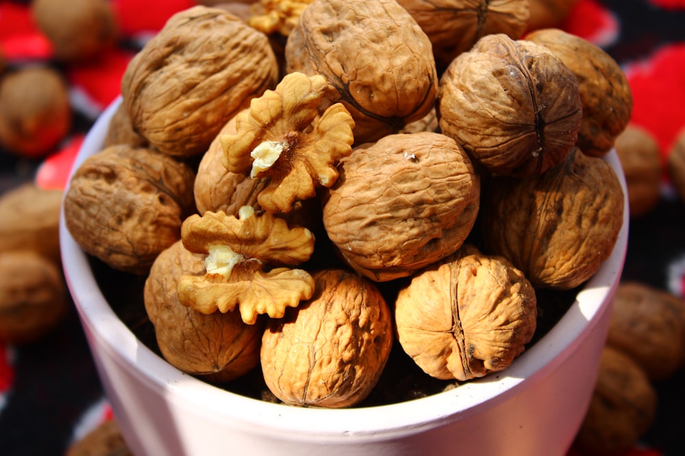 brown round fruit in white plastic container