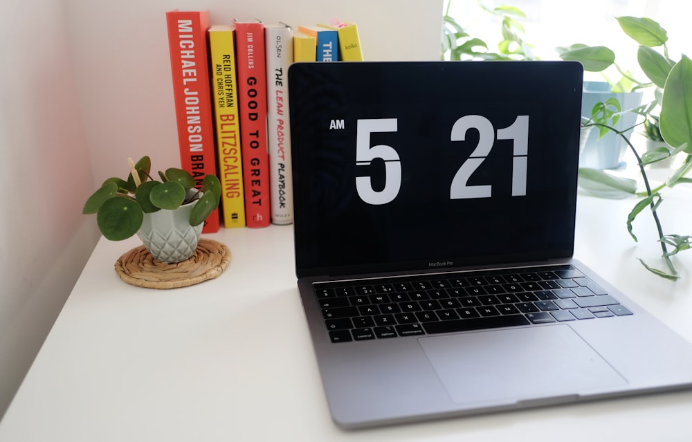 macbook pro on white table