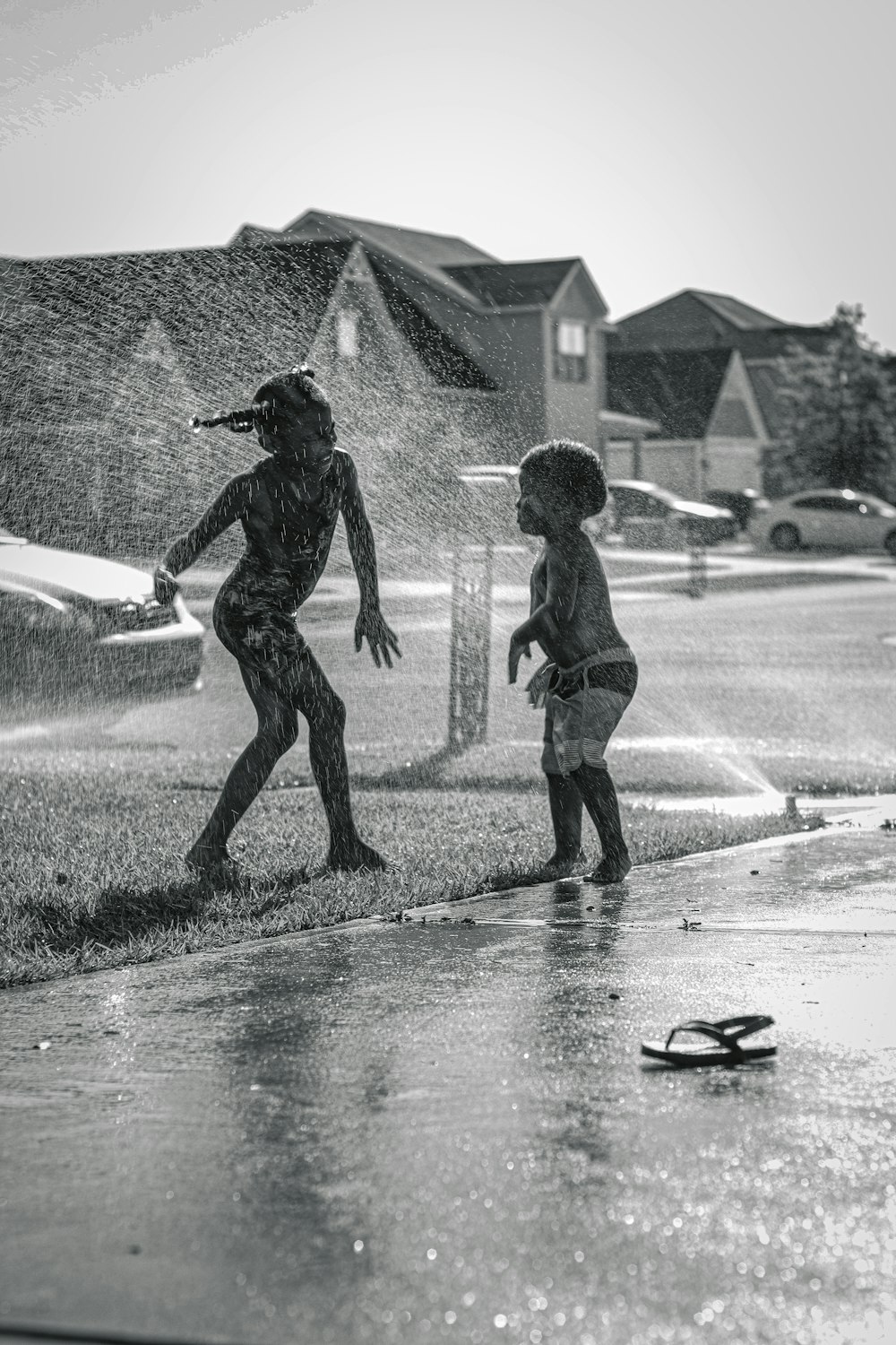 boy in black shirt playing on water