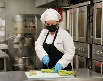 chef holding green and yellow plastic tray