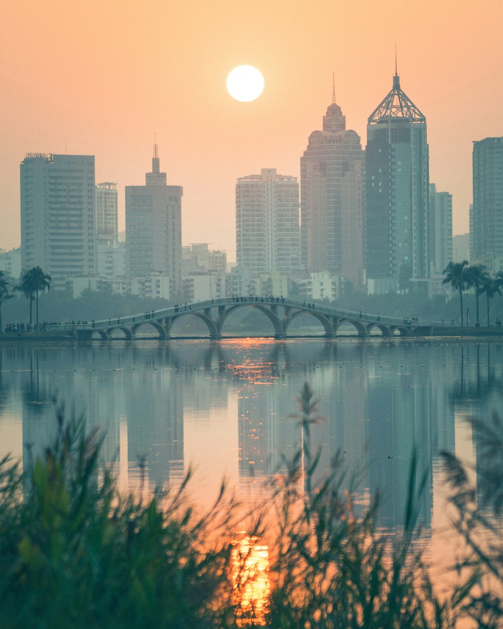 body of water near city buildings during daytime