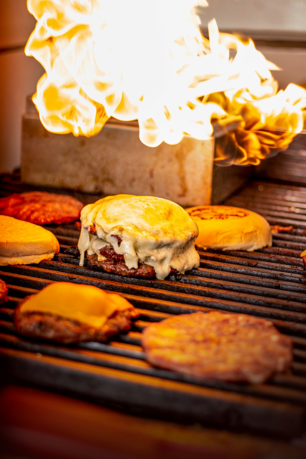 burger on black metal grill