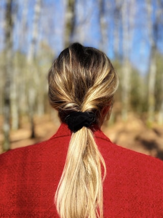 woman in red shirt with blonde hair