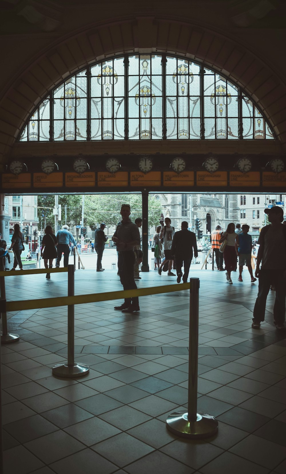 people walking on white floor tiles