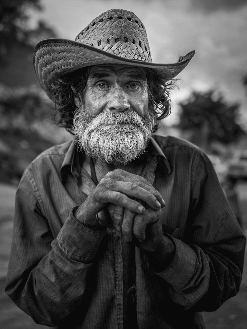 man in cowboy hat and coat