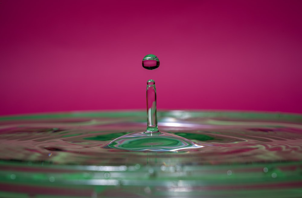 water drop in pink water