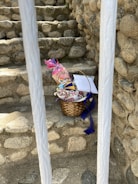 Close-up of a personalized gift basket with ribbons and custom tags.