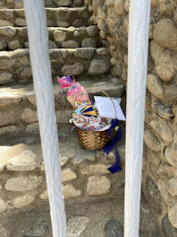 Close-up of a colorful, well-packed premium holiday basket with gourmet items.