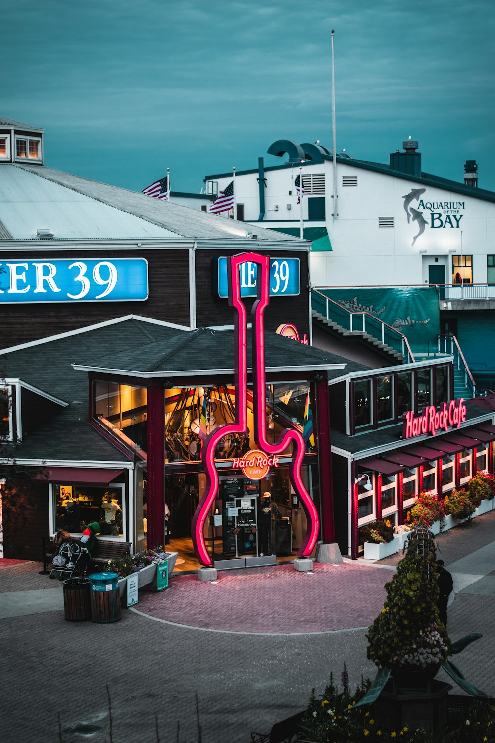 a building with a giant neon guitar in front of it