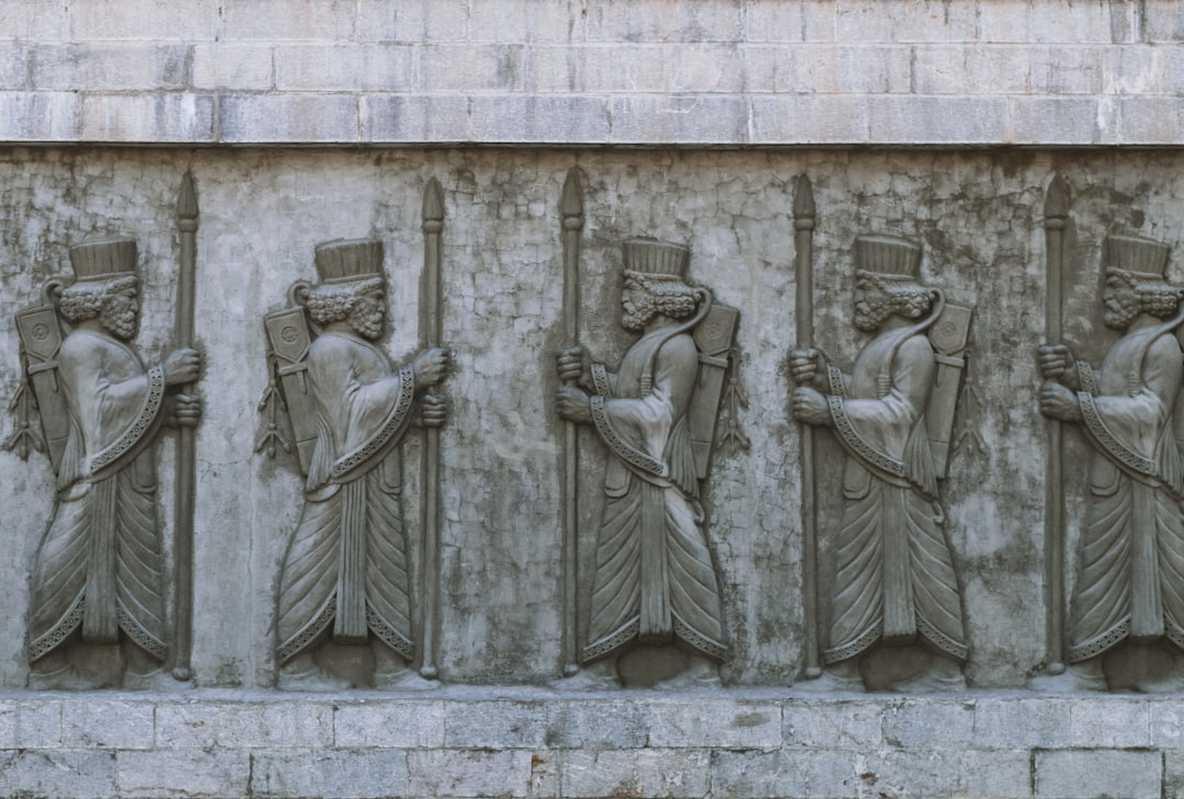 gray concrete statue of man and woman