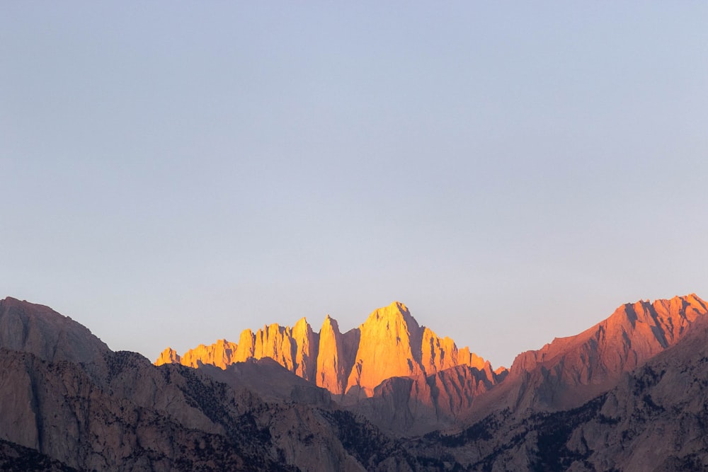 brown rocky mountains under white sky during daytime