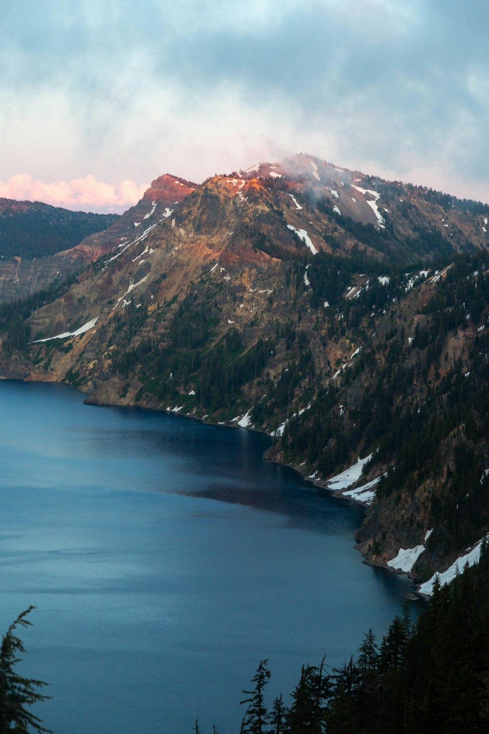 brown and gray mountain beside blue sea during daytime