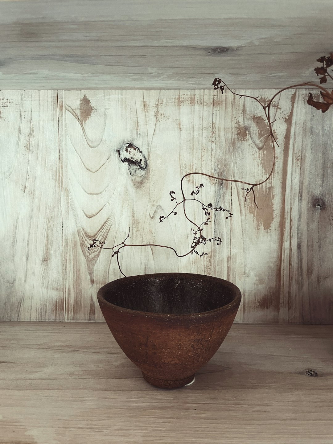 brown clay pot on brown wooden table