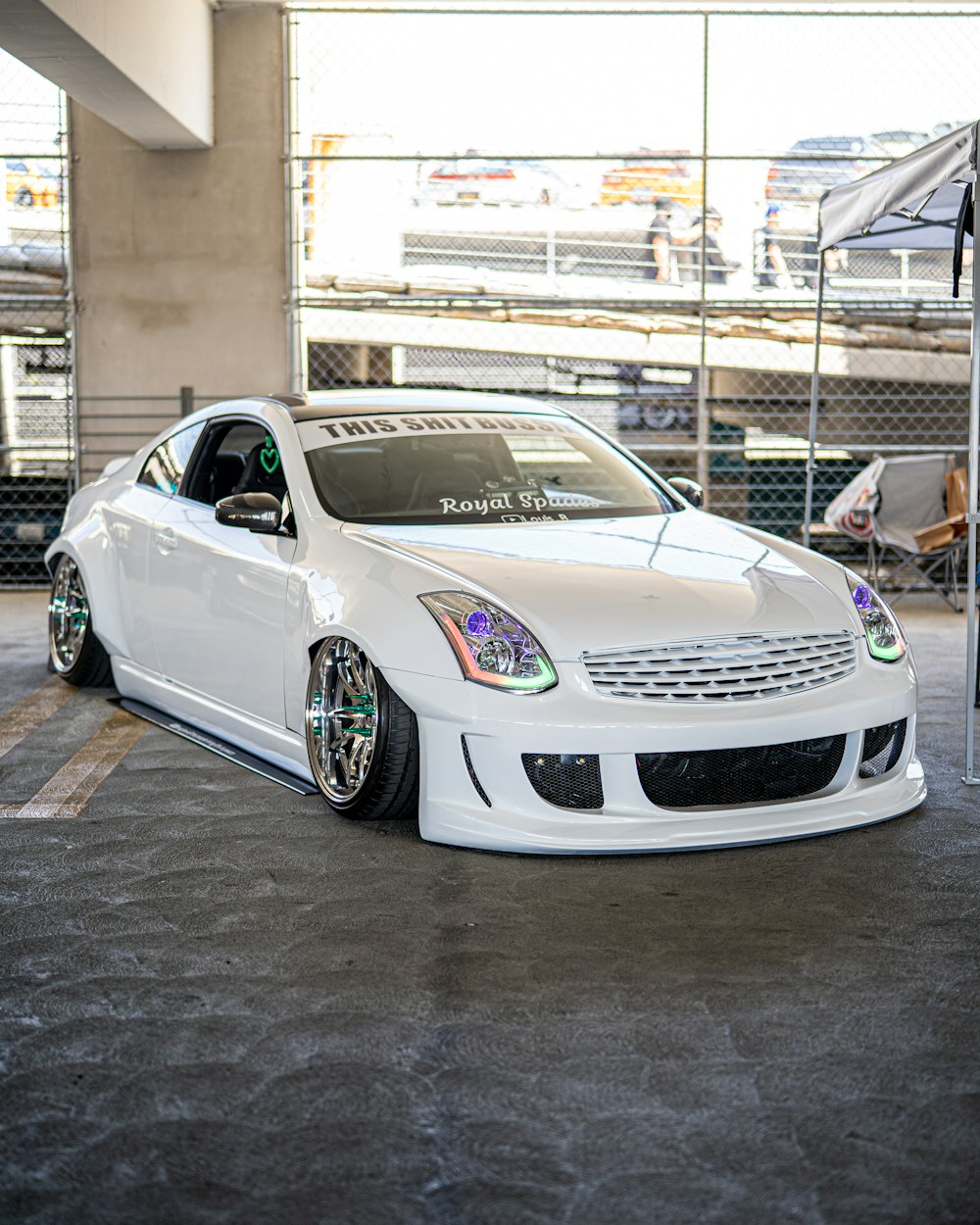 white bmw m 3 coupe parked on parking lot