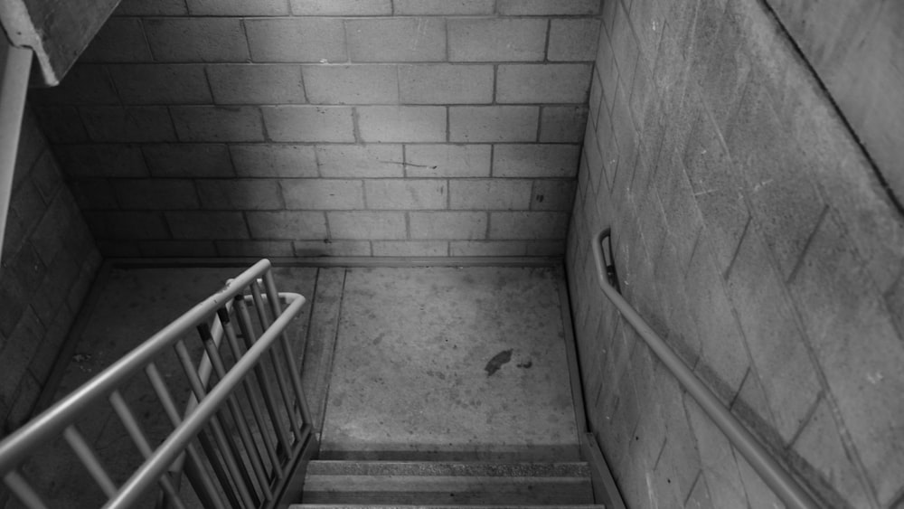 grayscale photo of concrete staircase