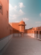 Traditional Moroccan riad courtyard with orange trees and tiled fountains.