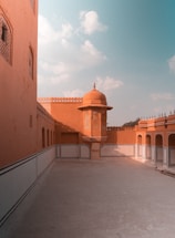 A warm Moroccan riad courtyard bathed in golden sunlight, inviting travelers to connect.