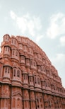 The intricate architecture of Hawa Mahal against a clear blue sky.