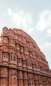 The intricate architecture of Hawa Mahal against a clear blue sky.