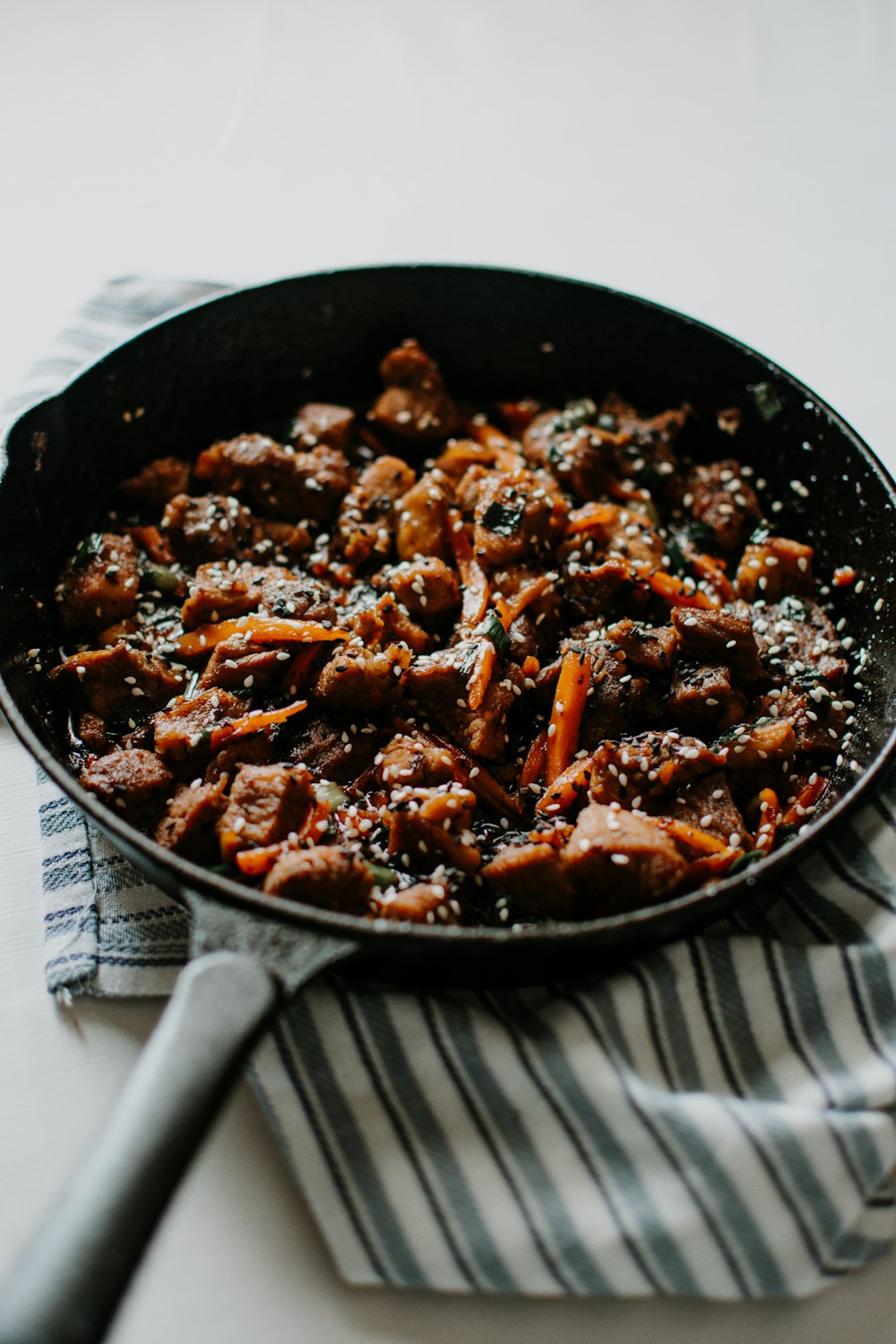 cooked food on black round plate