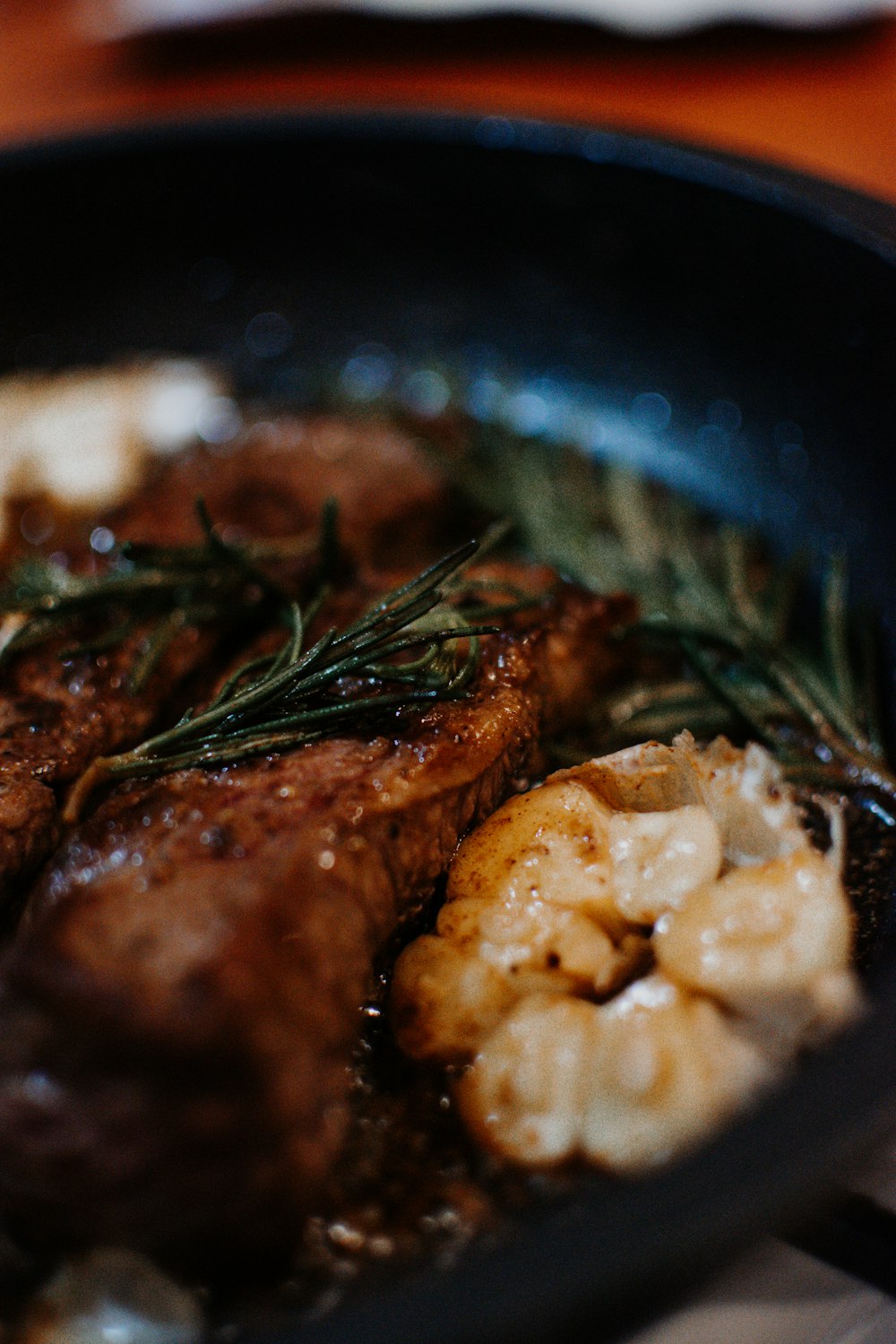 cooked food on black ceramic bowl