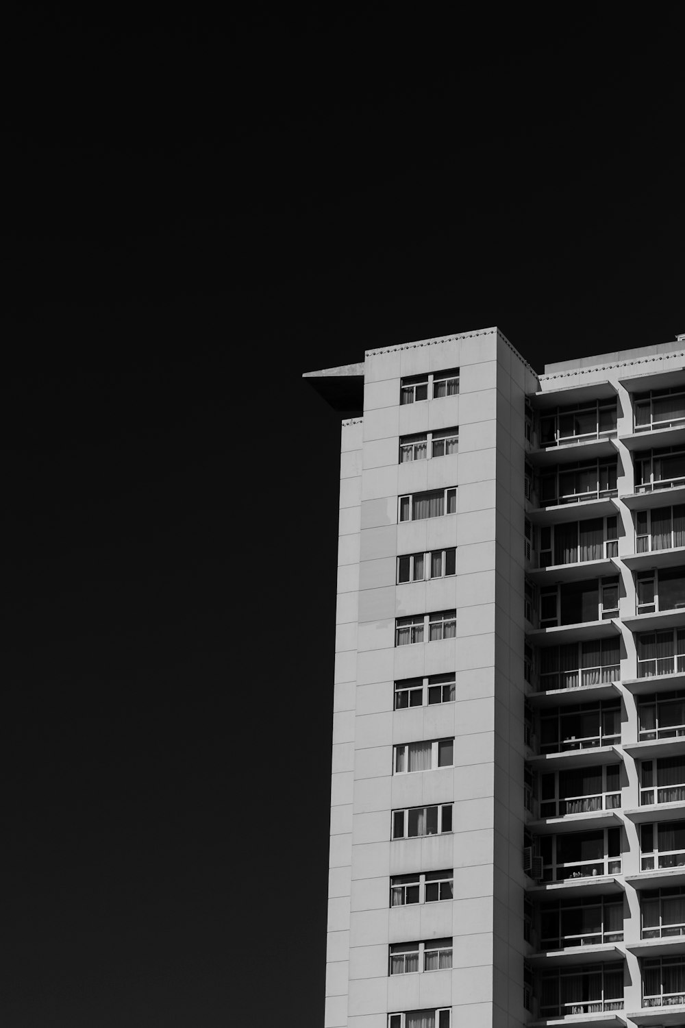 grayscale photo of high rise building