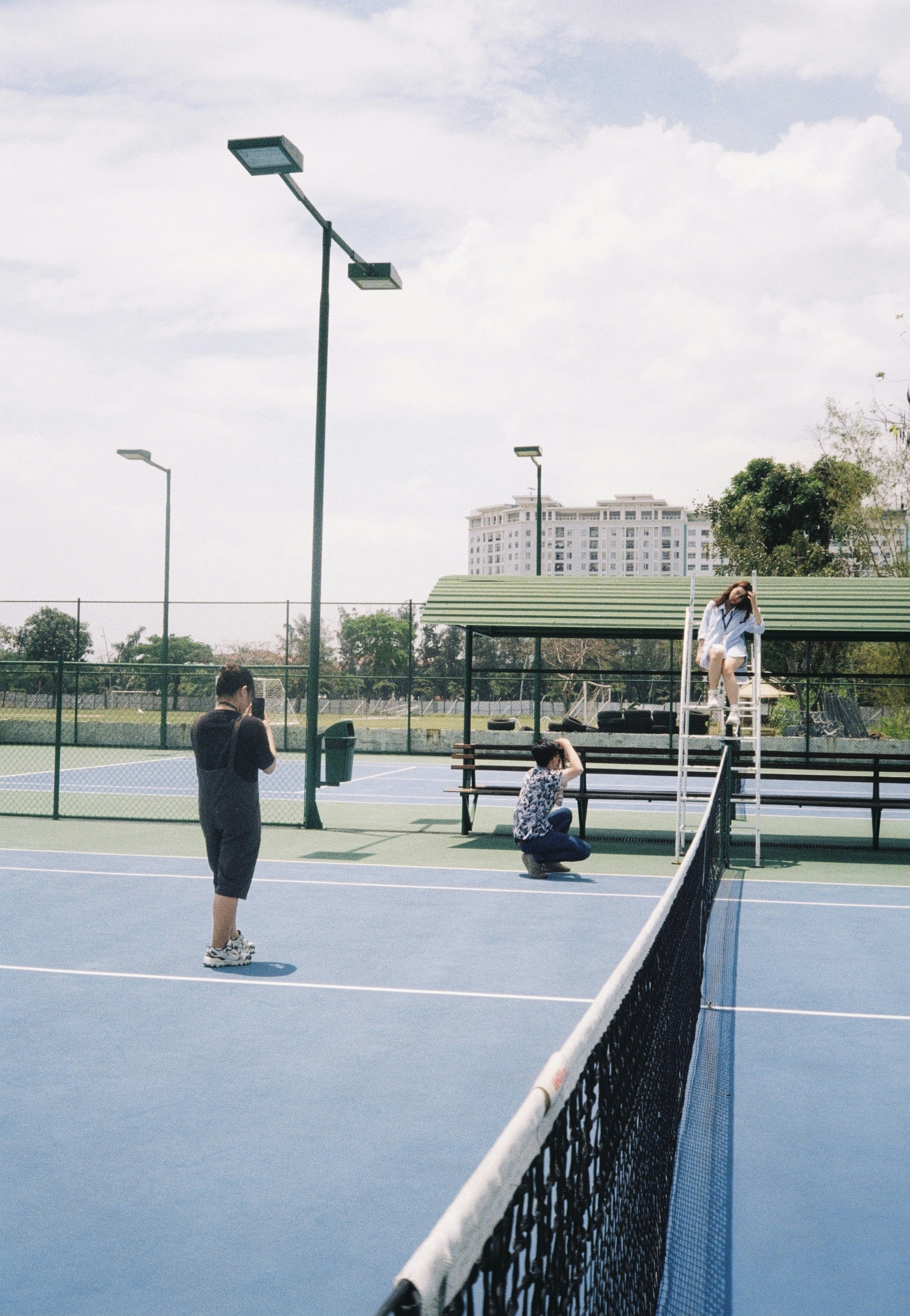 Maintenance crew working on a tennis court