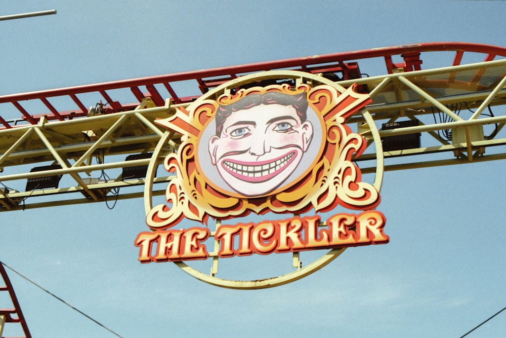 a sign that says the ticketer with a picture of a man's face