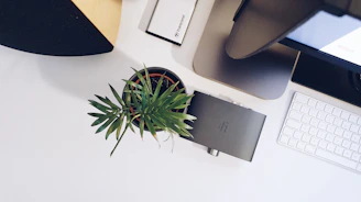 A modern workspace with compact speakers enhancing the audio experience without clutter.
