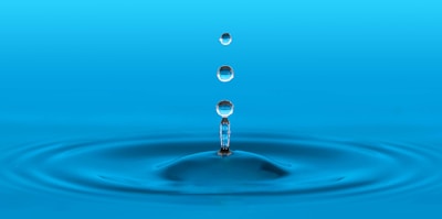 water drop in blue water