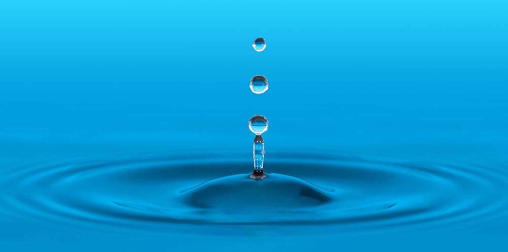 water drop in blue water