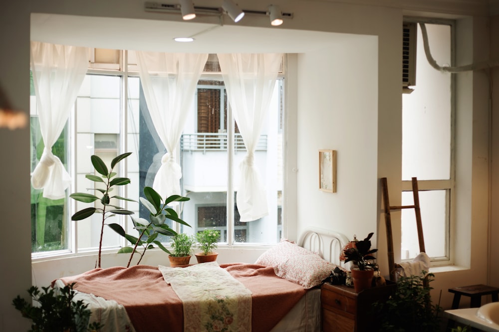 white bed linen on bed