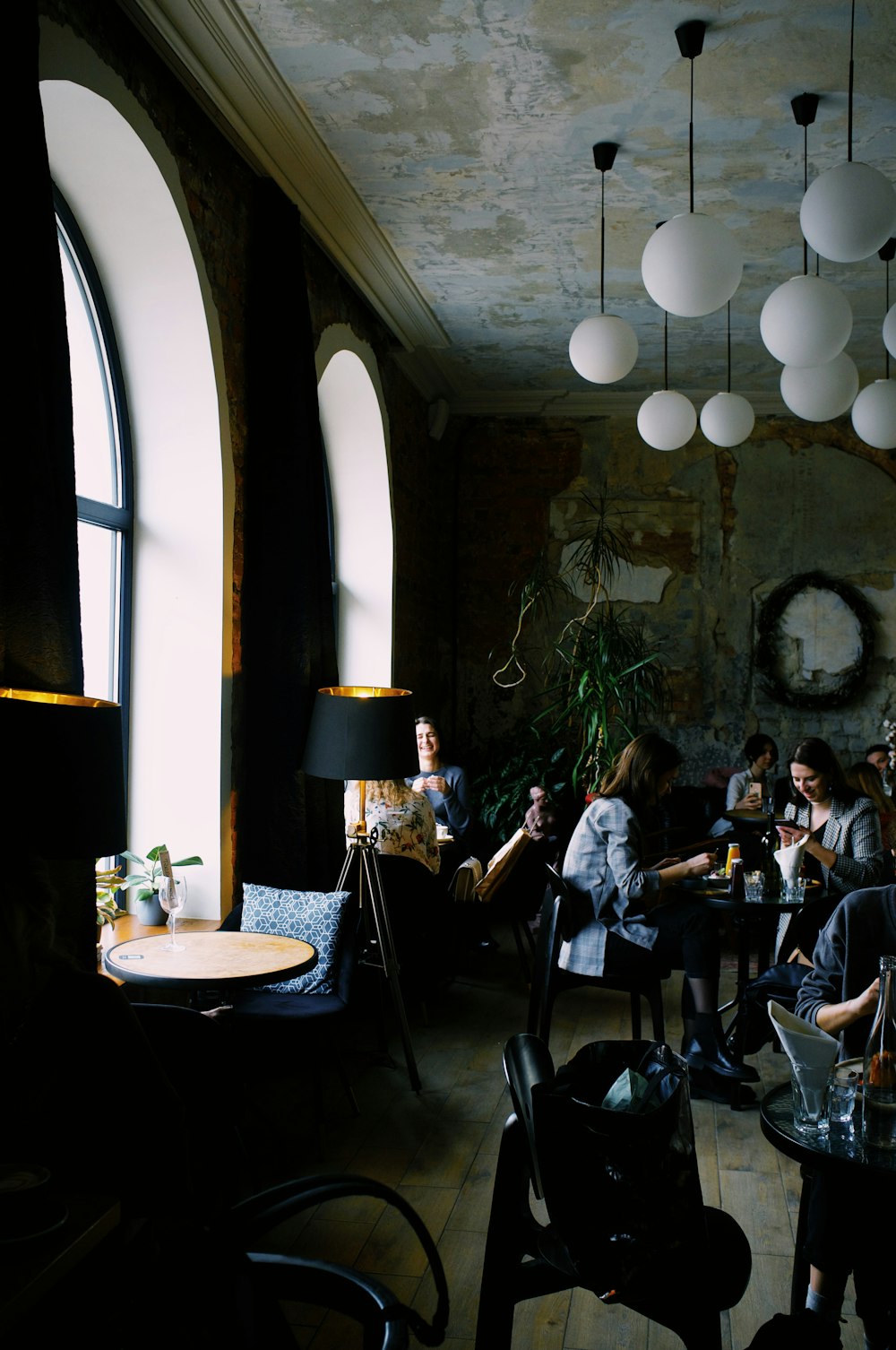 people sitting on chairs in restaurant