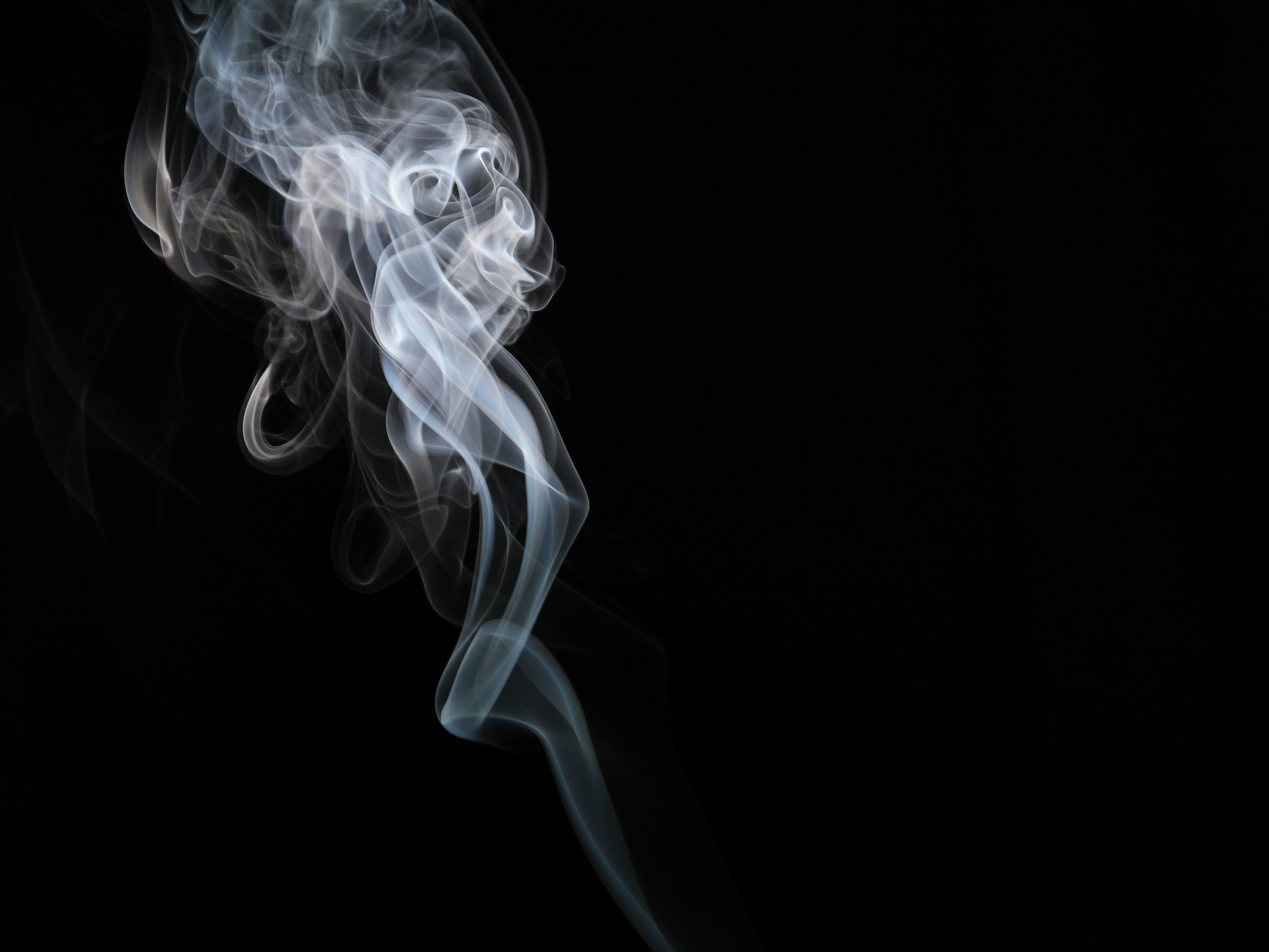 white smoke on black background