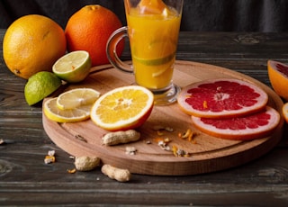 orange juice in clear drinking glass