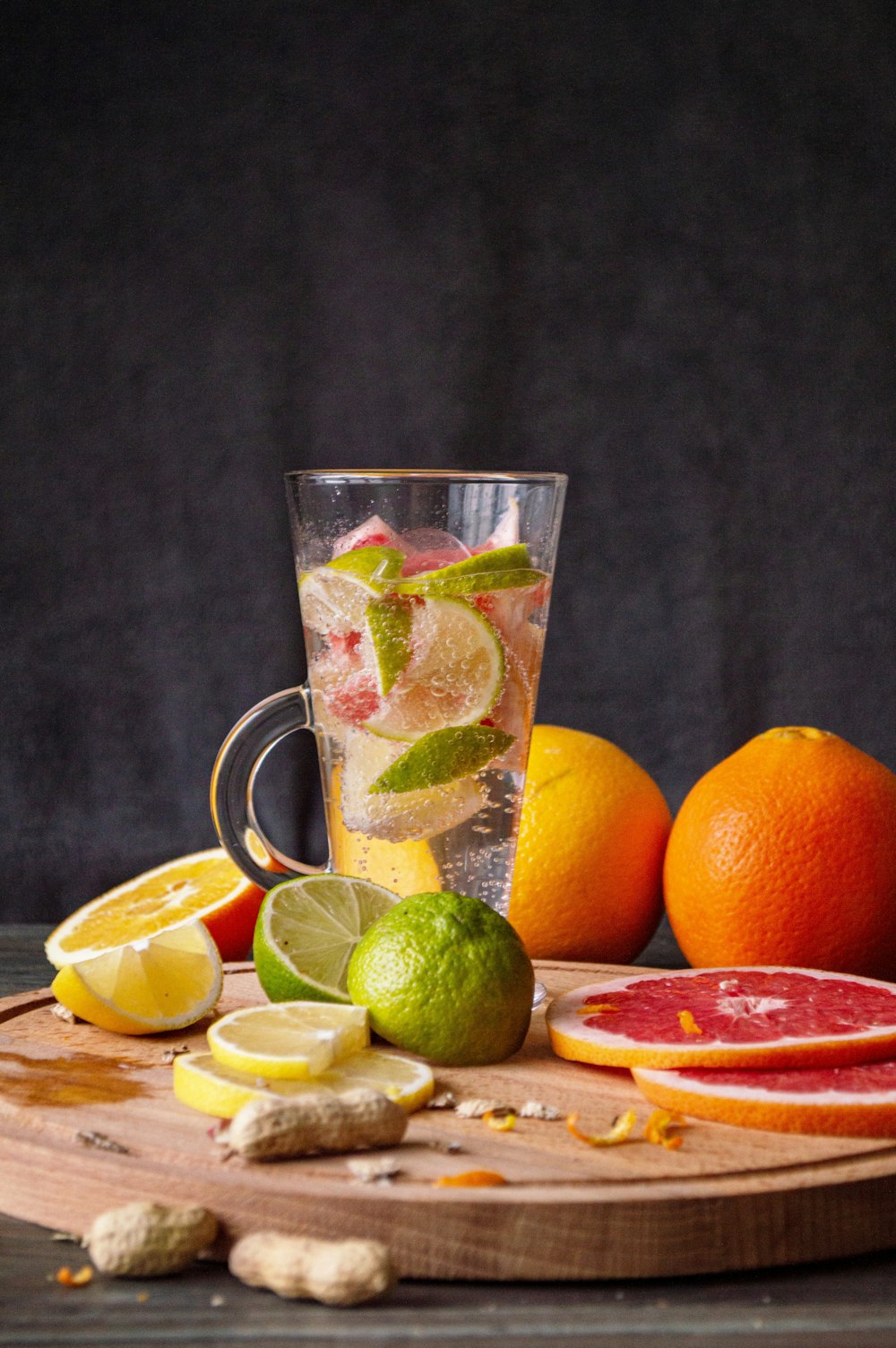 clear glass mug with orange fruits