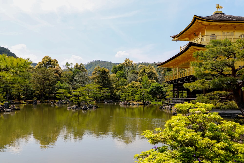 brown wooden house on lake during daytime