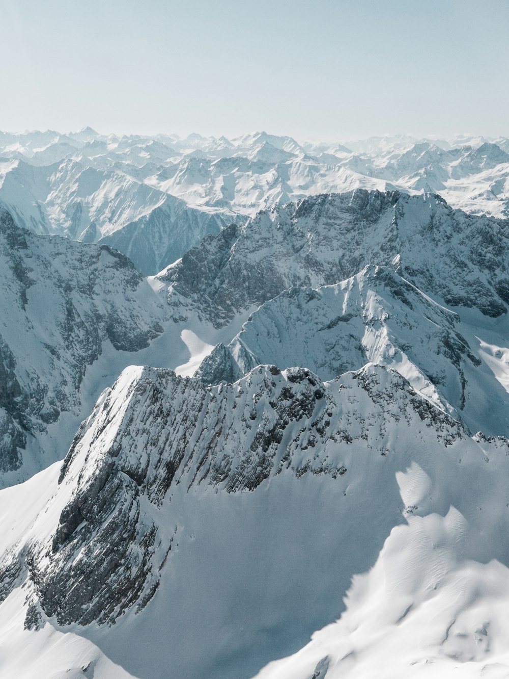 snow covered mountain during daytime