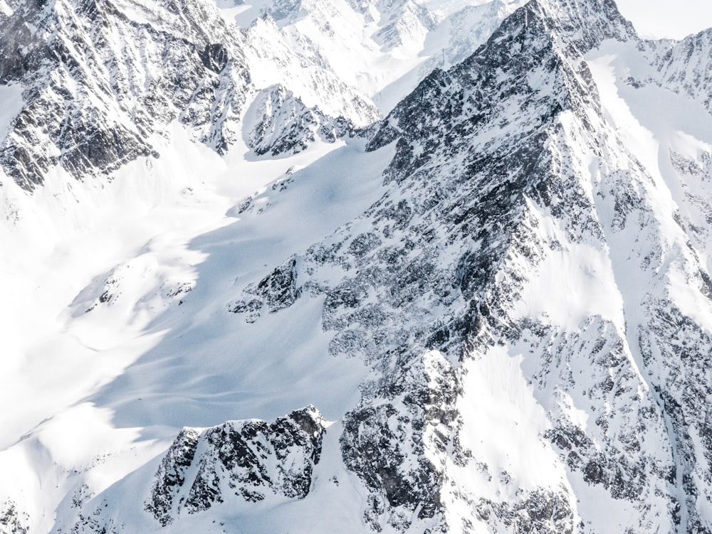 snow covered mountain during daytime