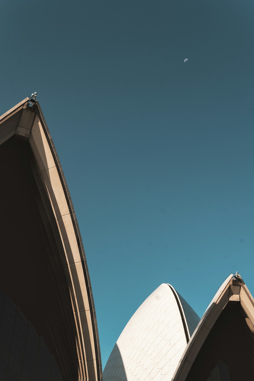 brown and white concrete building under blue sky during daytime