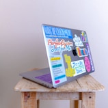 macbook pro on brown wooden table