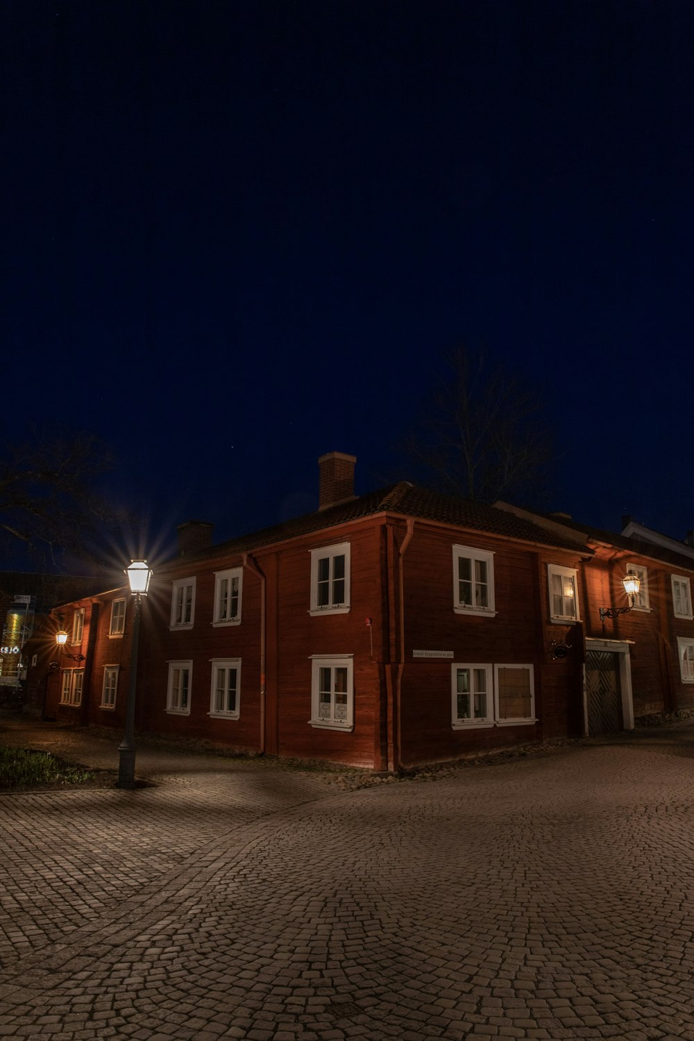 brown and white concrete house during night time