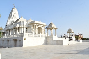 people walking on white concrete building during daytime