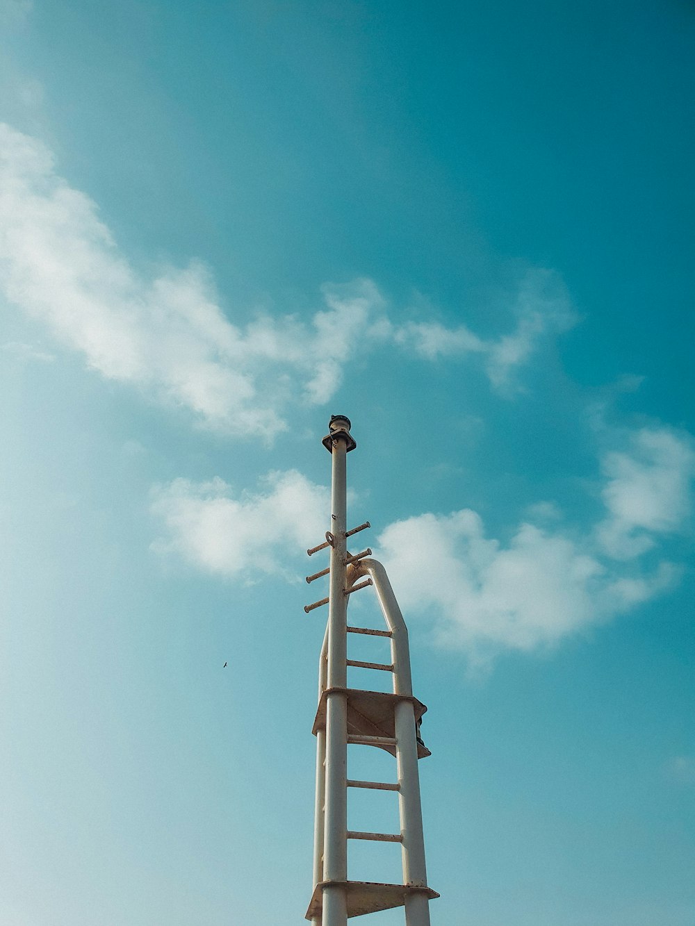 white concrete tower under blue sky during daytime