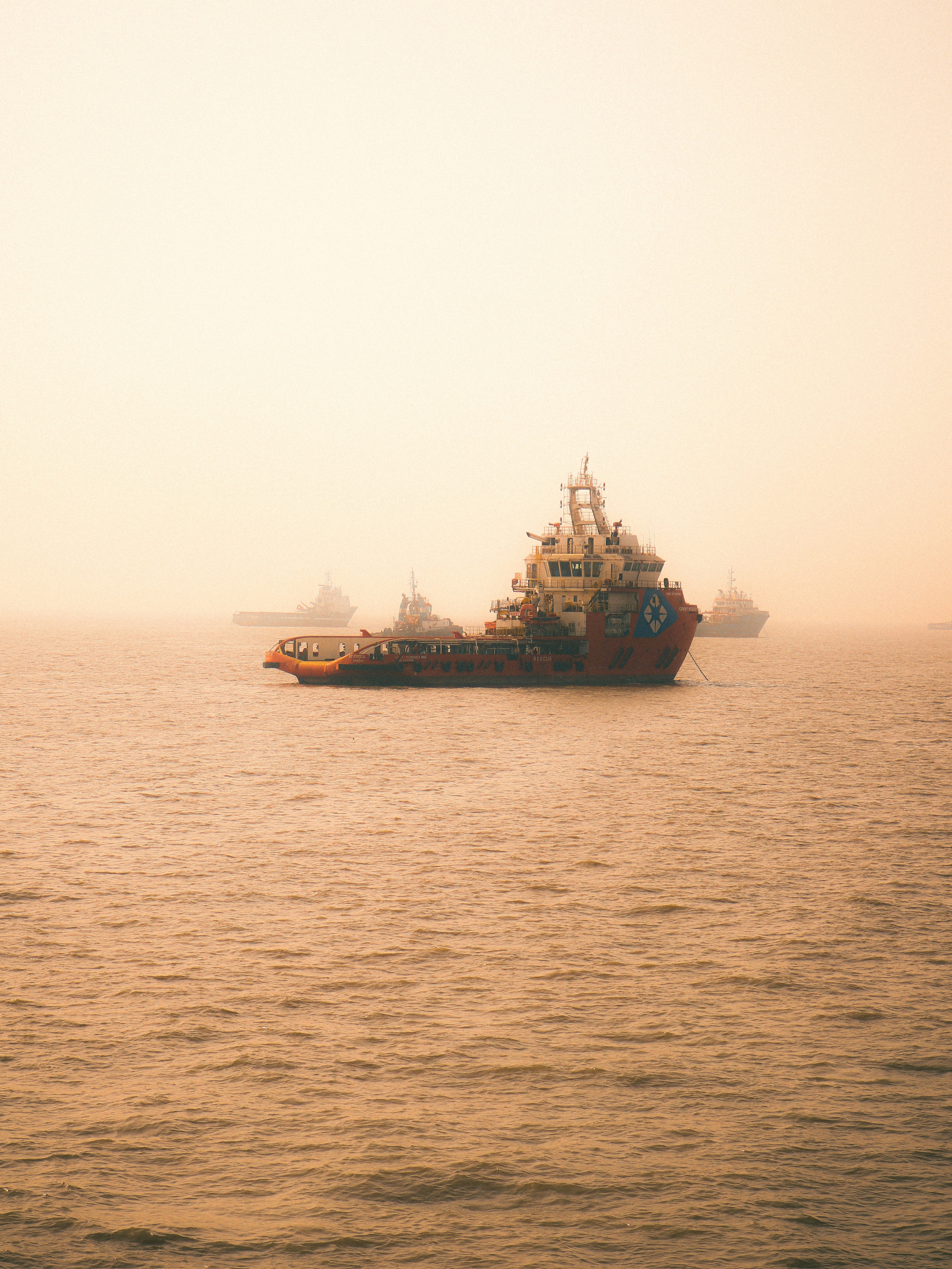 black and brown ship on sea under white sky during daytime